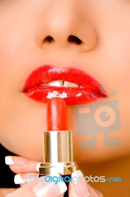 Close Up Of Beautician Applying Lipsticks On Woman's Lips Stock Photo