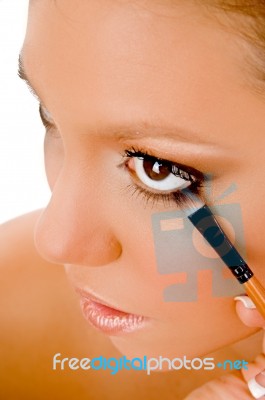 Close Up Of Female Putting Eye Liner Stock Photo