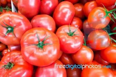 Close Up Of Fresh, Juicy, Ripe Tomatoes Pile. Lycopene And Antioxidant In Fruit Nutrition Good For Health And Skin. Flat Lay Stock Photo