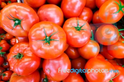 Close Up Of Fresh, Juicy, Ripe Tomatoes Pile. Lycopene And Antioxidant In Fruit Nutrition Good For Health And Skin. Flat Lay Stock Photo