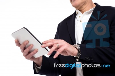 Close Up Of Male Hand Using Tablet Stock Photo