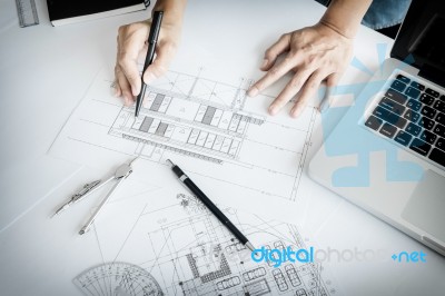 Close-up Of Person's Engineer Hand Drawing Plan On Blue Print Wi… Stock Photo