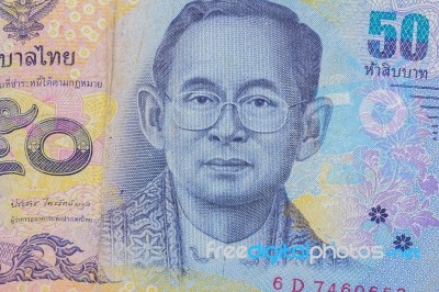 Close Up Of Thailand Currency, Thai Baht With The Images Of Thailand King. Denomination Of 50 Bahts Stock Photo