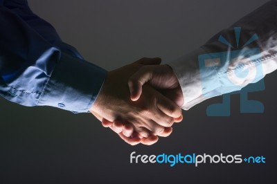 Close Up Of Two Male Hands Shaking Stock Photo