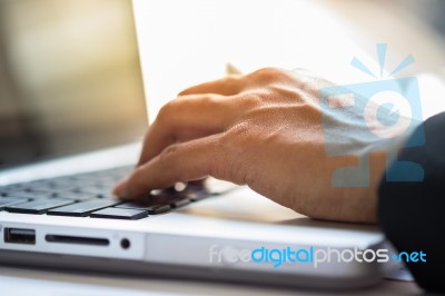 Close-up Of Typing Male Hands Stock Photo