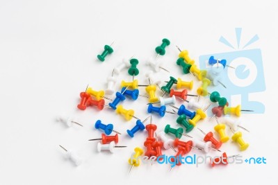 Close Up Of Various Pushpins On White Background Stock Photo