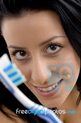 Close Up Of Woman Showing Toothbrush Stock Photo