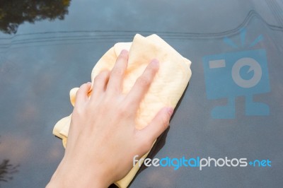 Close Up Of Yellow Chamois (microfiber Towel) On Car Stock Photo