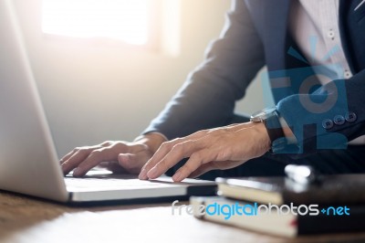 Close Up Of Young Businessman Working Typing On Laptop In Coffee… Stock Photo