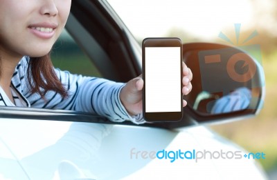 Close-up Phone In Woman Hand Showing Blank Screen Sitting In Car… Stock Photo