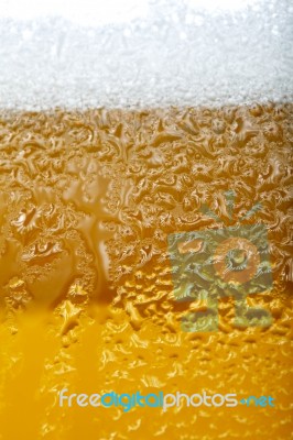 Close-up Picture Of A Beer With Foam And Bubbles Stock Photo