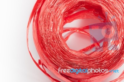 Close Up Red Plastic Rope Top View On White Background Stock Photo