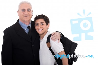 Close Up Shot Of Old Business Man Embraces A Teenager Stock Photo