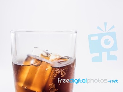 Close Up Two Of Thirds Soft Drink Is Cool And Ice Cubes  In Glass On White Background Stock Photo