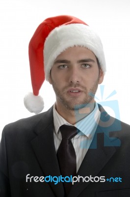 Close Up View Of Businessman In Santa Cap Stock Photo