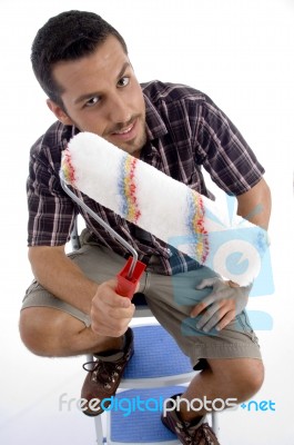 Close Up View Of Rolling Brush And Man Holding Stock Photo