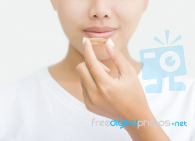 Close Up Woman Taking Vitamin Capsule For Healthy Stock Photo