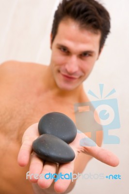 Close-up Young Man With Stones Palm Stock Photo