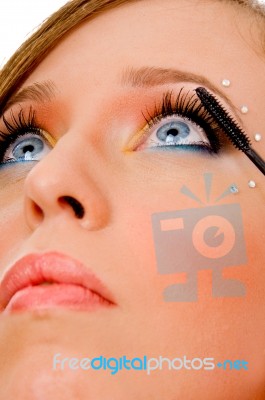 Close View Of Woman Applying Makeup Stock Photo