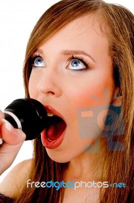 Close View Of Woman Singing Into Karaoke Stock Photo