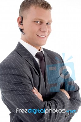 Close View Of Young Executive With Blue Tooth Stock Photo