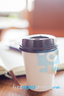 Closed Up Coffee Cup On Wooden Table Stock Photo