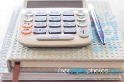 Closeup Calculator, Pen And Notebooks Stock Photo