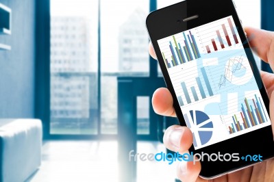 Closeup Hand Holding Mobile Phone Show Analyzing Graph Stock Photo