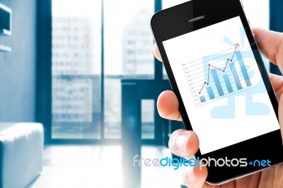 Closeup Hand Holding Mobile Phone Show Analyzing Graph Stock Photo