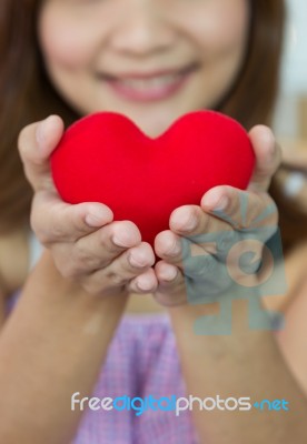 Closeup Heart Shape With Women's Hands In Vertical Stock Photo