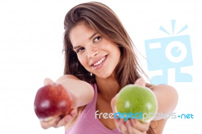 Closeup Of A Girl Giving Apple In Both Hands Stock Photo