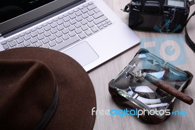 Closeup Of A Wooden Table With Laptop Stock Photo