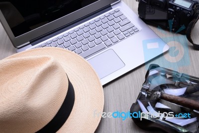 Closeup Of A Wooden Table With Laptop Stock Photo