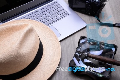 Closeup Of A Wooden Table With Laptop Stock Photo