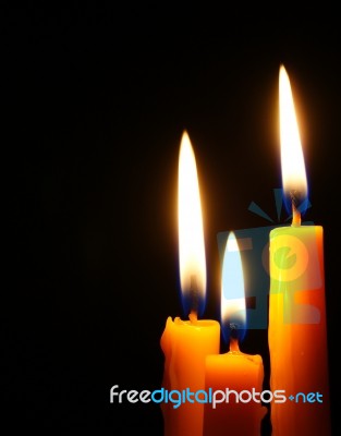 Closeup Of Burning Candles Isolated  Stock Photo