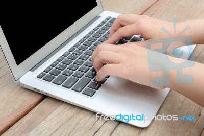 Closeup Of Business Woman Hand Typing On Laptop Keyboard Stock Photo