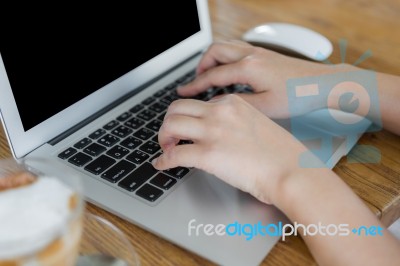 Closeup Of Business Woman Hand Typing On Laptop Keyboard Stock Photo