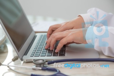 Closeup Of Business Woman Hand Typing On Laptop Keyboard Stock Photo