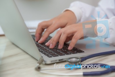 Closeup Of Business Woman Hand Typing On Laptop Keyboard Stock Photo