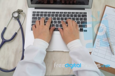 Closeup Of Business Woman Hand Typing On Laptop Keyboard Stock Photo