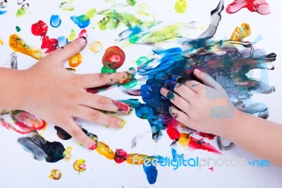 Closeup Of Little Children Hands Doing Finger Painting With Vari… Stock Photo