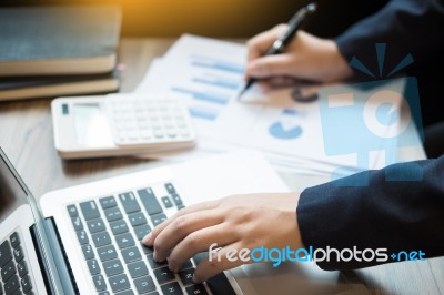 Closeup Of Young Business Man Working At Office With Laptop And Stock Photo