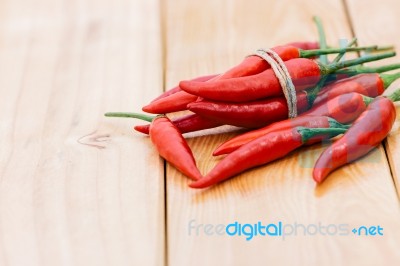 Closeup Red Chili Peppers Spice Ingredient On Wood Table Stock Photo