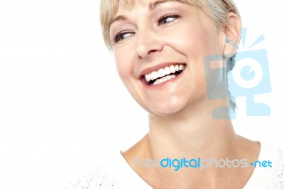 Closeup Shot Of A Beautiful Woman Smiling Heartily Stock Photo