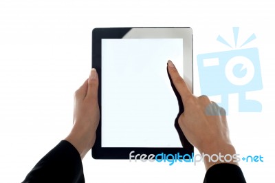 Closeup Shot Of Female Finger Operating Tablet Stock Photo