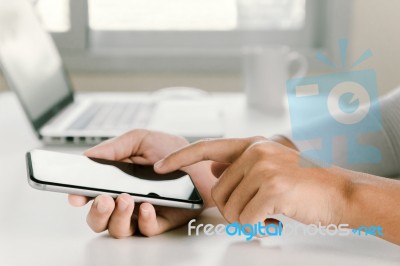 Closeup Woman Hand Using Phone On Workspace In Office Stock Photo