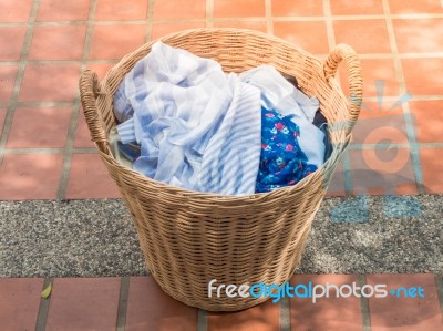 Clothes In A Laundry Wooden Basket Stock Photo