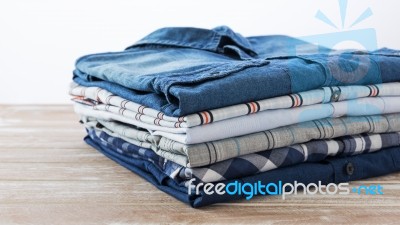 Clothes On Wooden Table Stock Photo