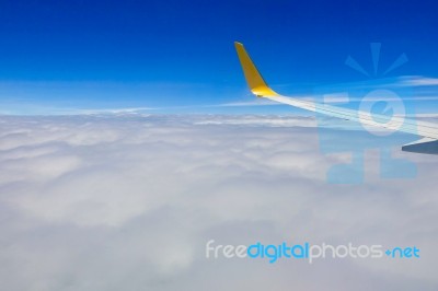 Clouds And Sky As Seen Through Window Of Aircraft Stock Photo