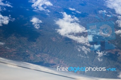 Cloudy Sky View From Airplane Cabin Window Stock Photo